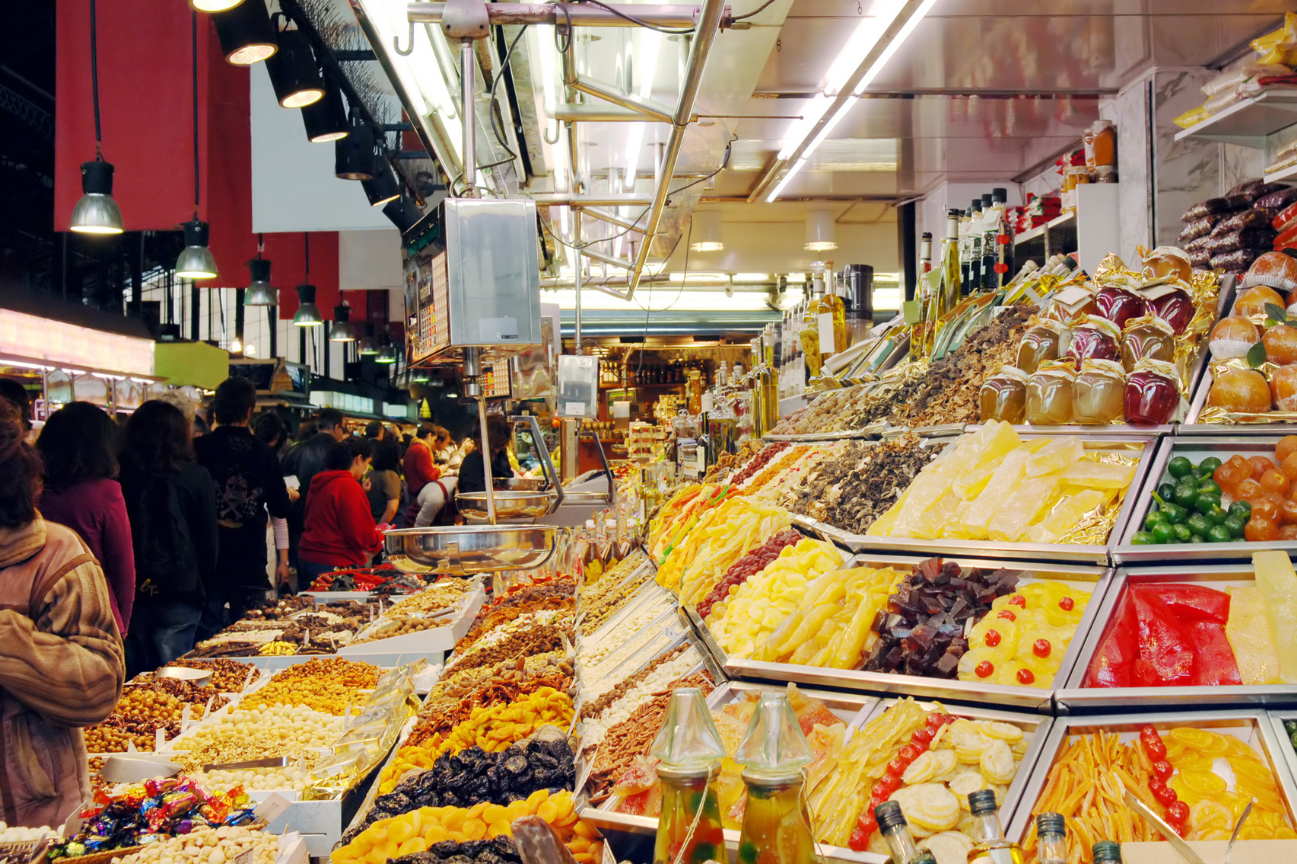 A market stall in Barcelona, piled high with sweets and baked goods