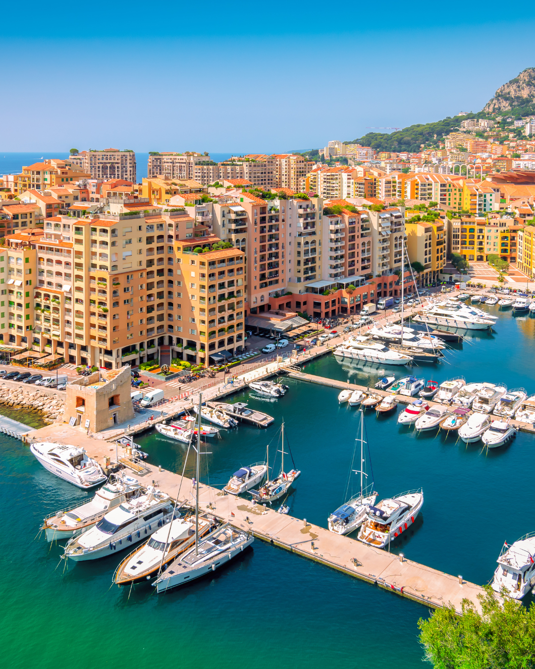 An aerial view of Monaco with the harbour in the foreground