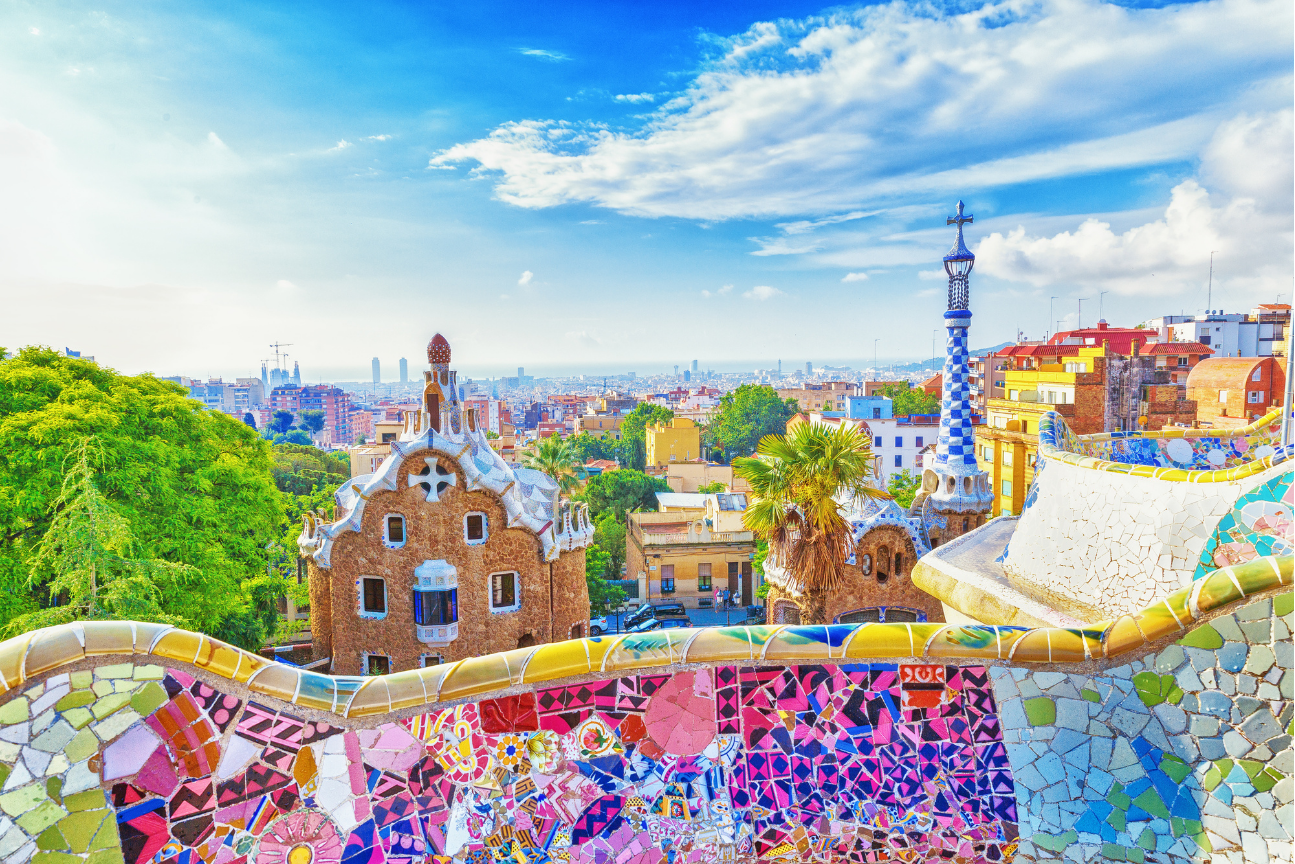 Park Güell in Barcelona, seen looking over a brightly coloured balustrade