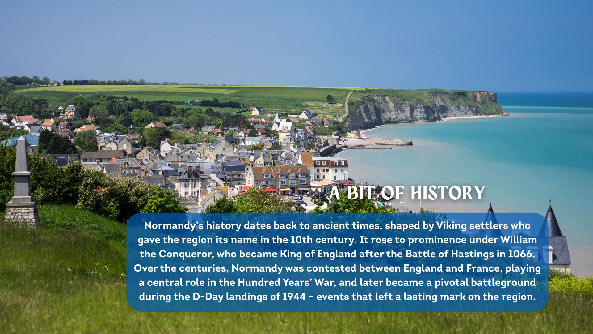 A view of a coastal village in Normandy with white cliffs in the background