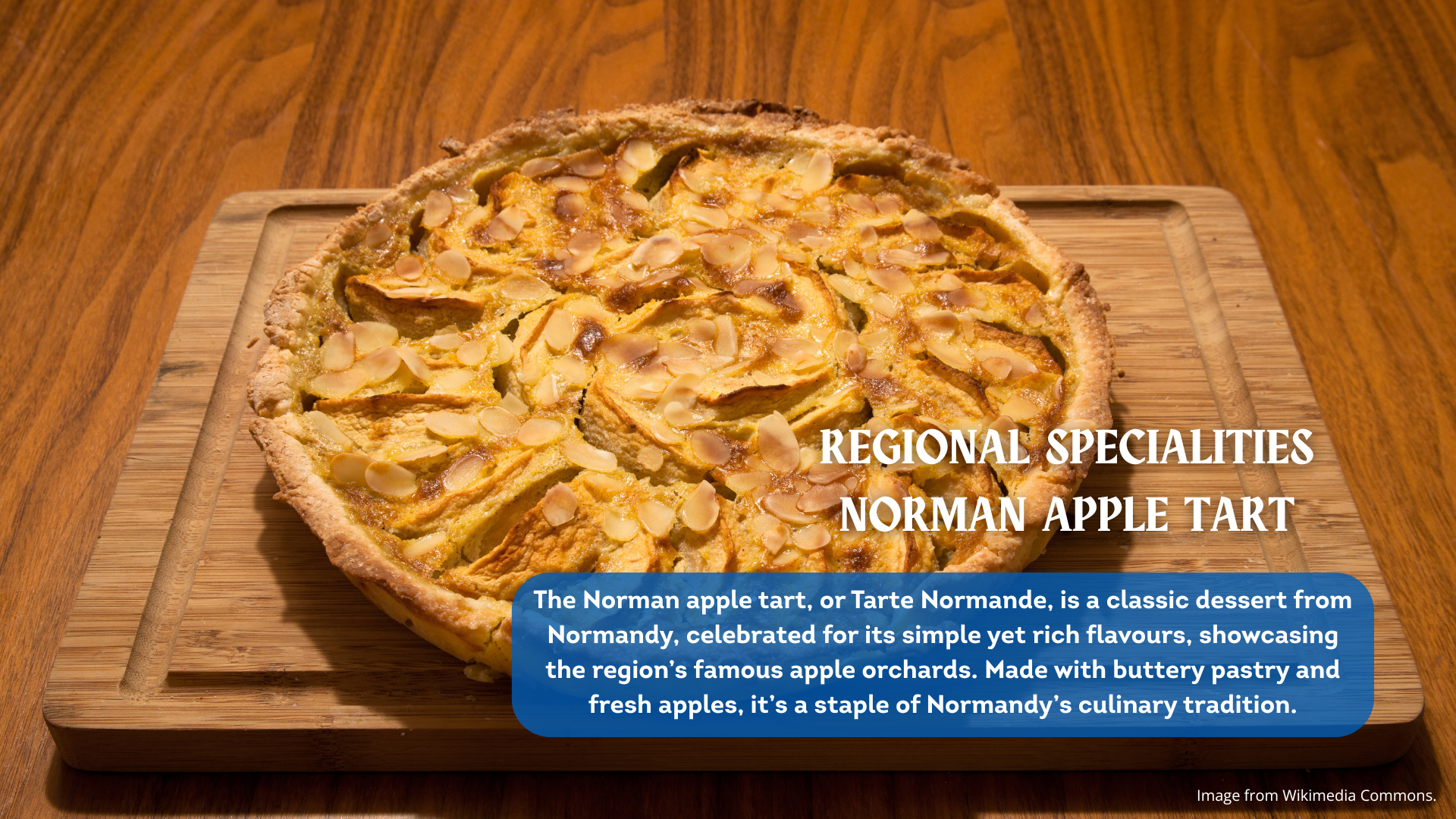 A round apple tart on a wooden board