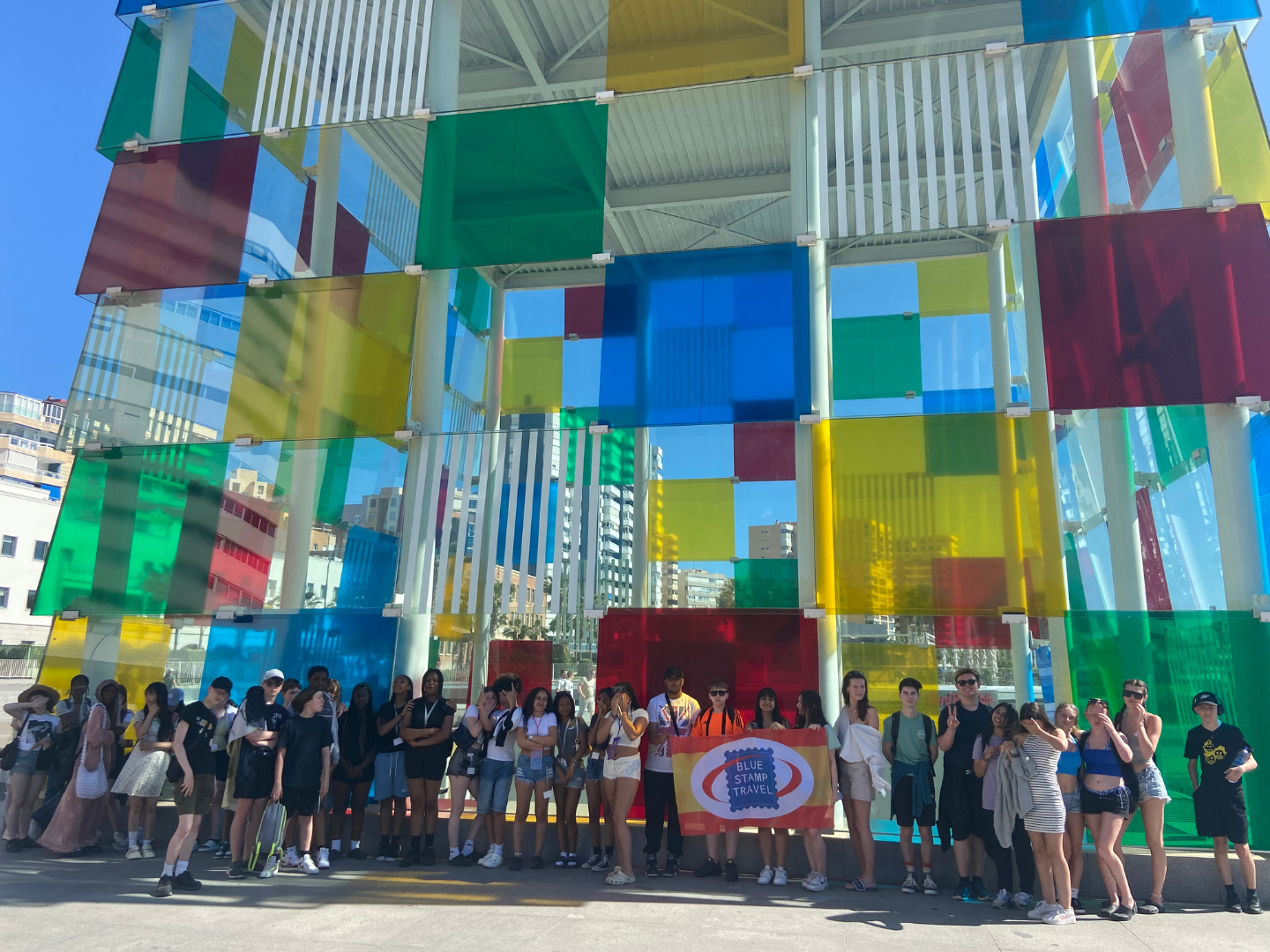 A group of students on a school trip to Andalusia pose in front of the Pompidou Centre in Malaga