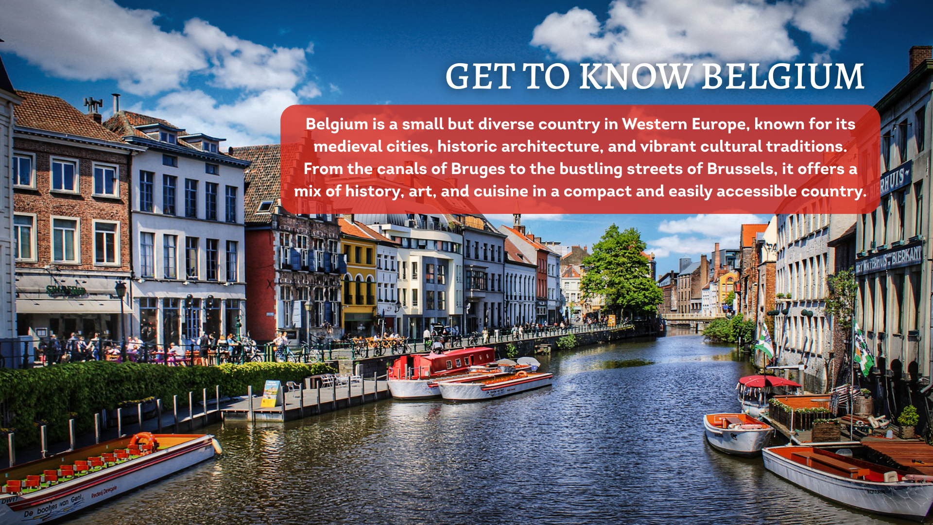 A canal in Belgium with brightly-coloured boats and historic houses to either side.