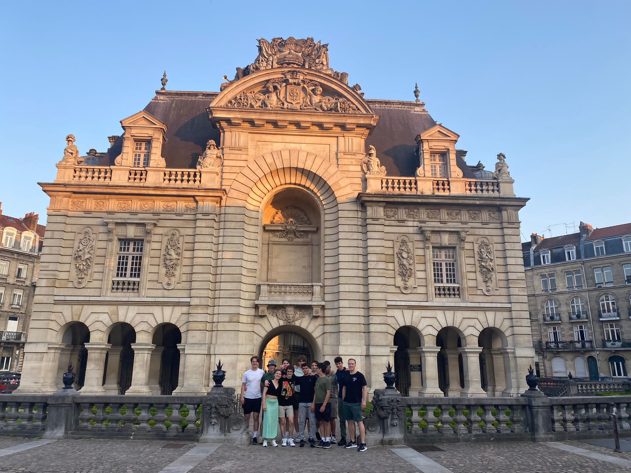 A group of students in front of a historic building in Lille