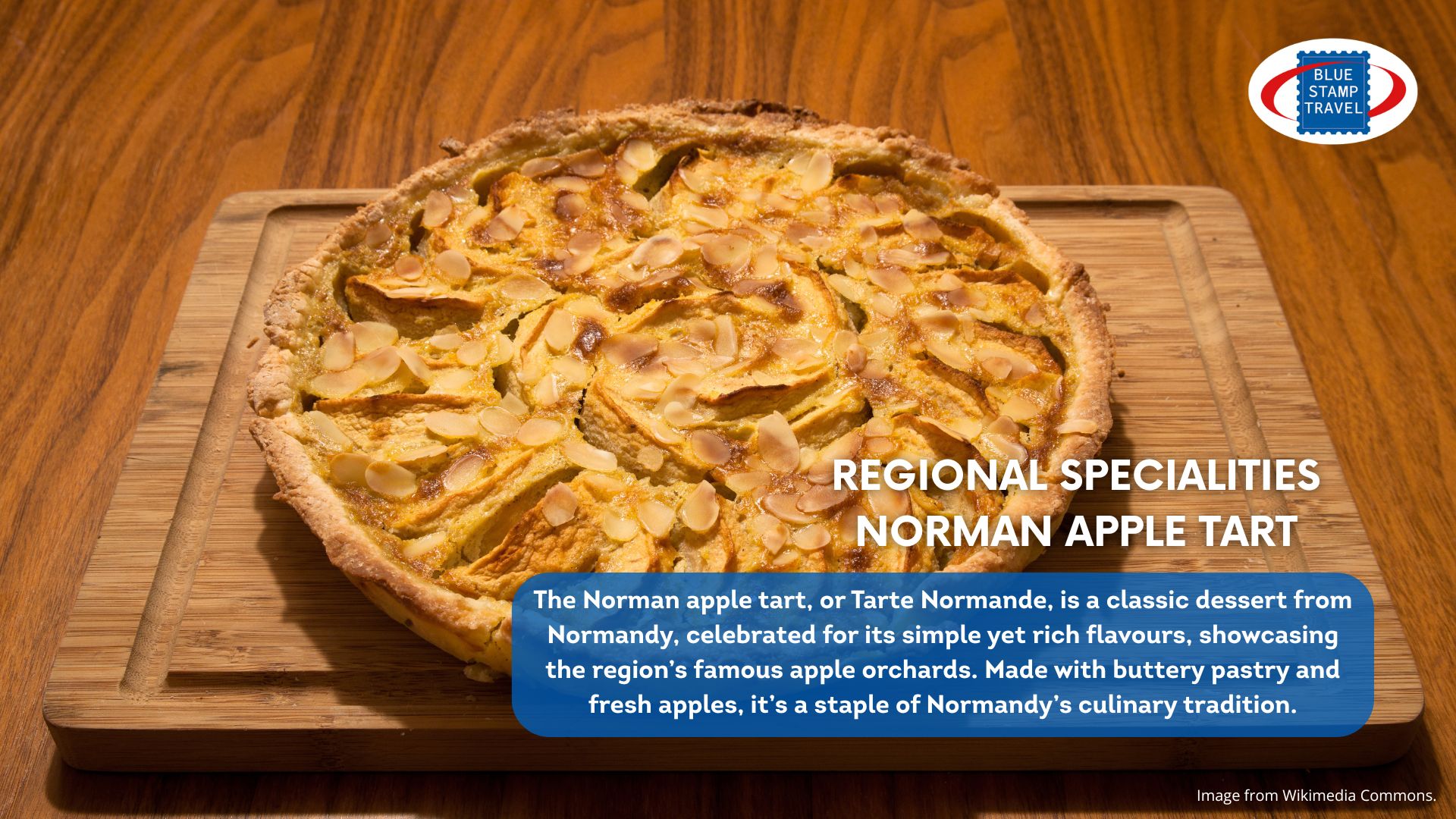 A delicious-looking apple tart sits on a wooden chopping board. Flaked almonds have been scattered over the fruit.