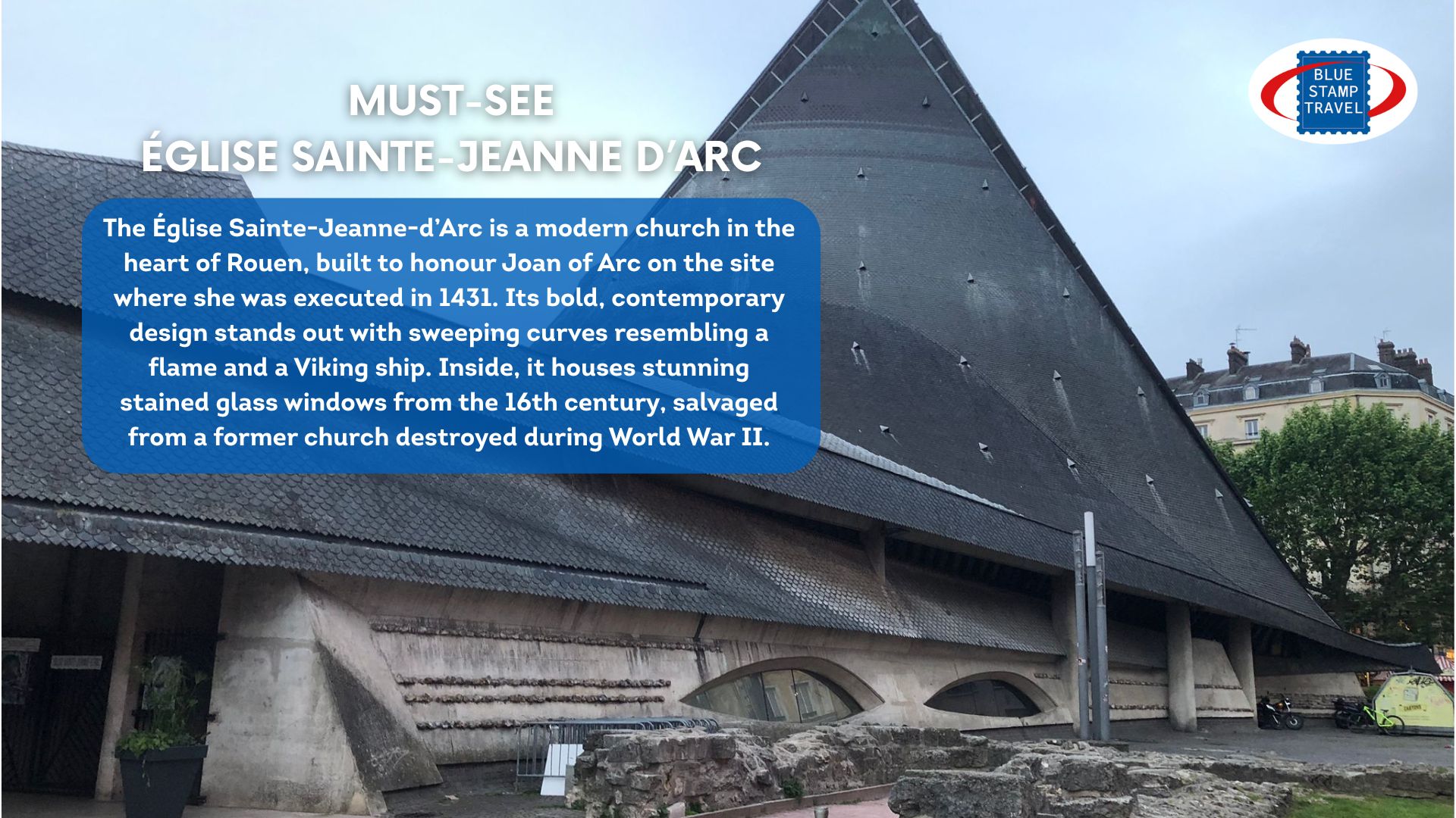 The dark grey geometric roof of a modern church, its shape reminiscent of a ship or piece of armour.