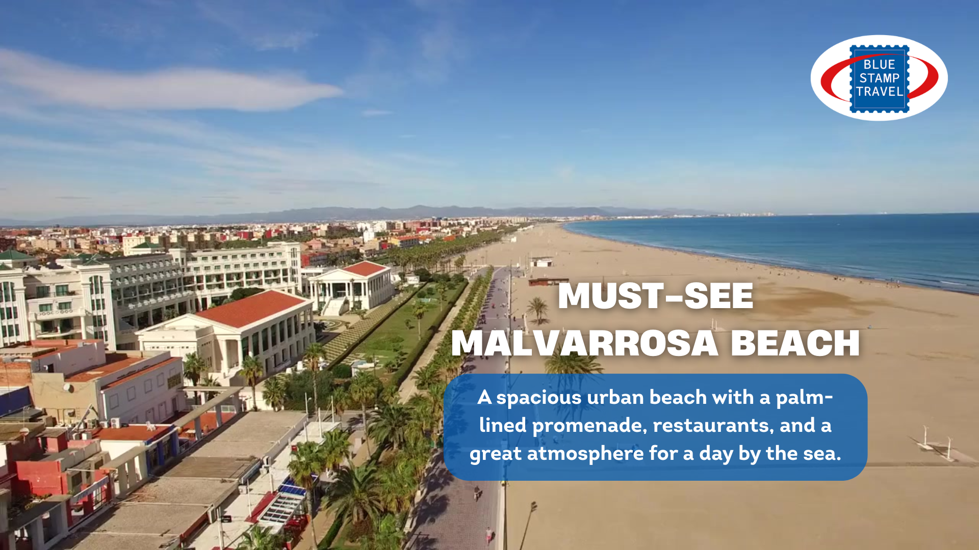 An aerial view of a beach on a sunny day. To the left is a promenade with distinctive classically-styled buildings, overlaid with "Must-See Malvarrosa Beach" and the Blue Stamp Travel logo.