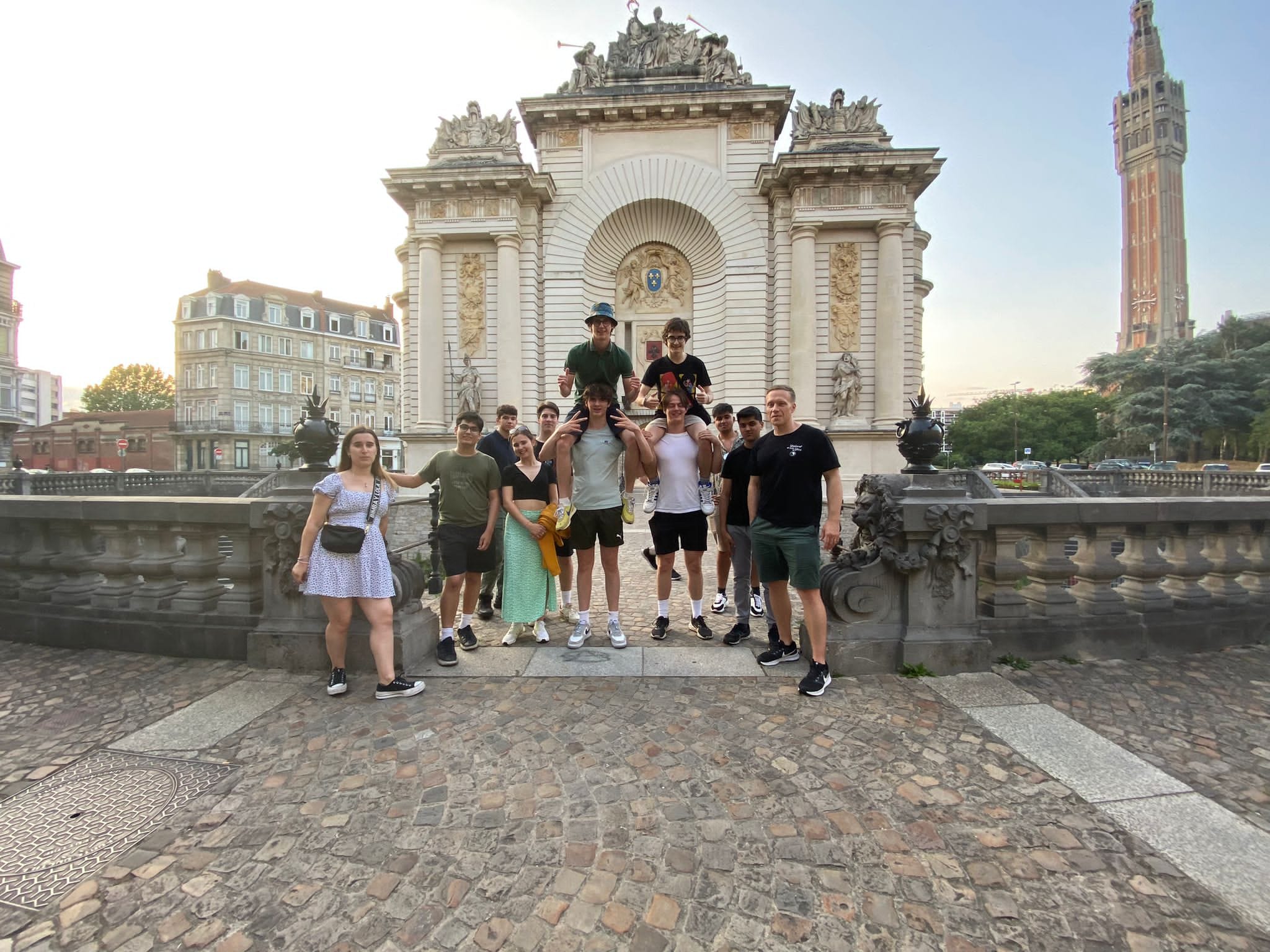 Work Experience students in a group photo outside a historic building in France