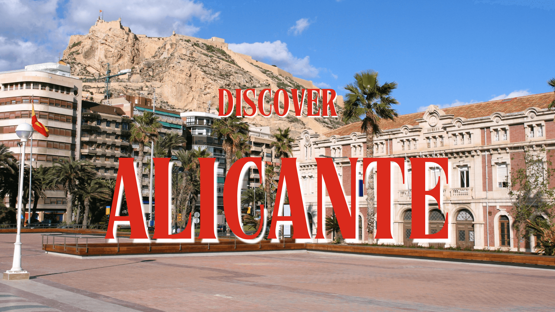 Alicante, looking from the marina towards the castle with modern and historic hotels in the foreground.