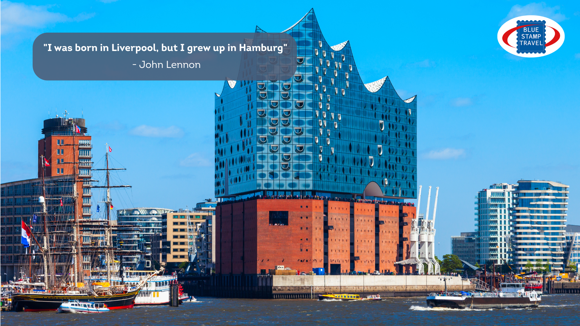 The Elbephilharmonie concert hall with its striking glass upper structure, the curves resembling sails, while the glass reflects the blue of the water and the sky. A sailing ship sits alongside in the front-left of the image.