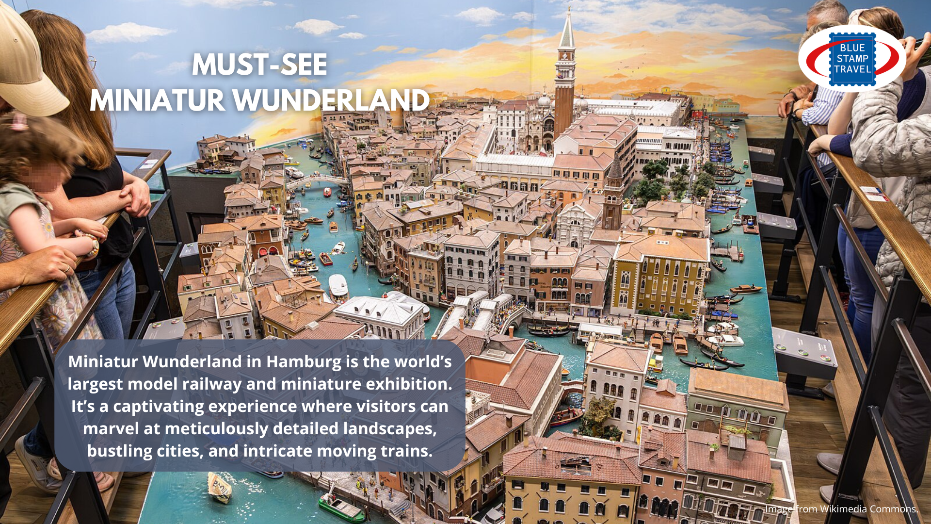 Visitors to Miniatur Wunderland look down on a model of Venice, with a model of St Mark's Basilica in the background