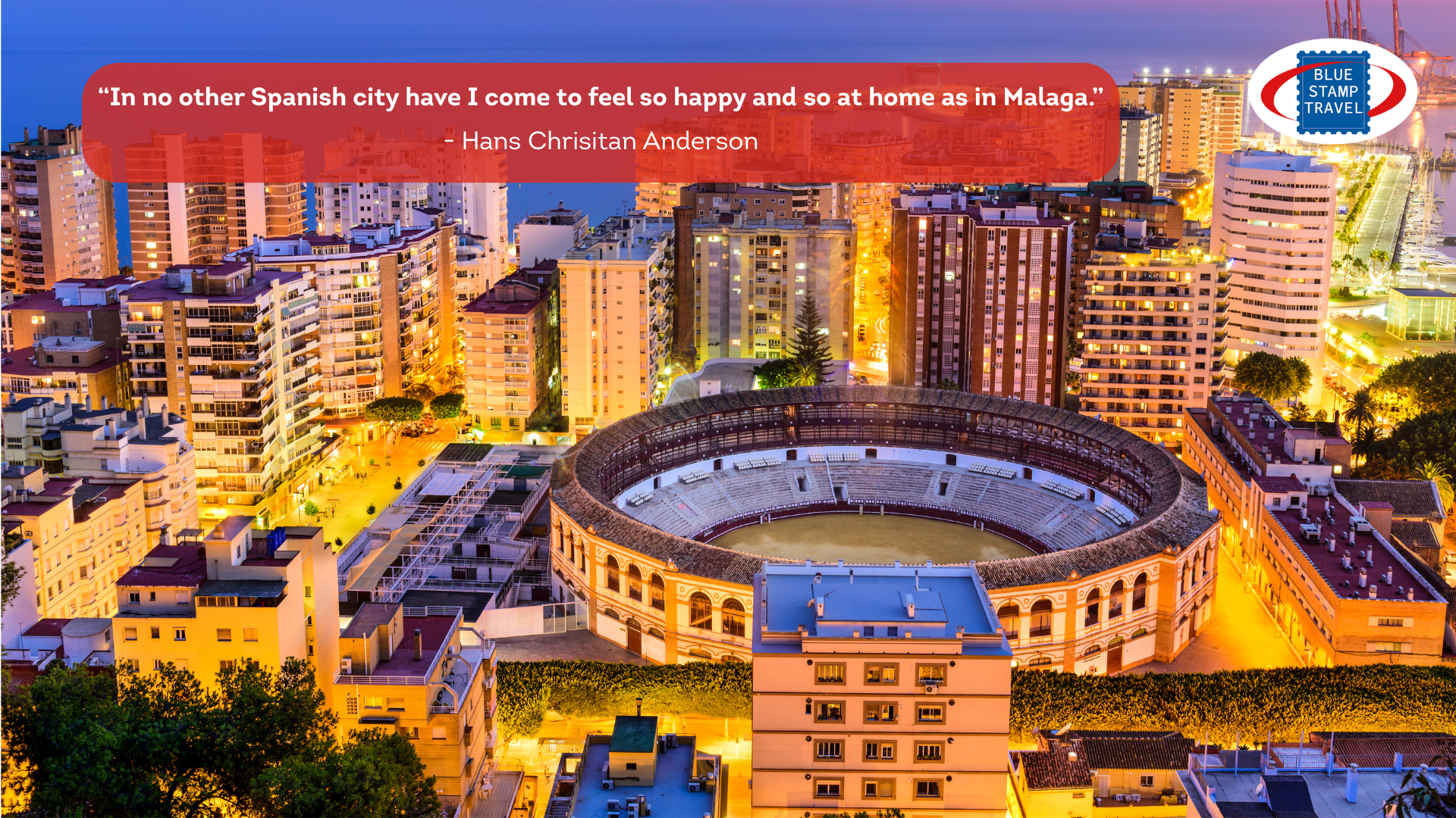 Malaga bull ring seen from above at twilight, surrounded by residential buildings