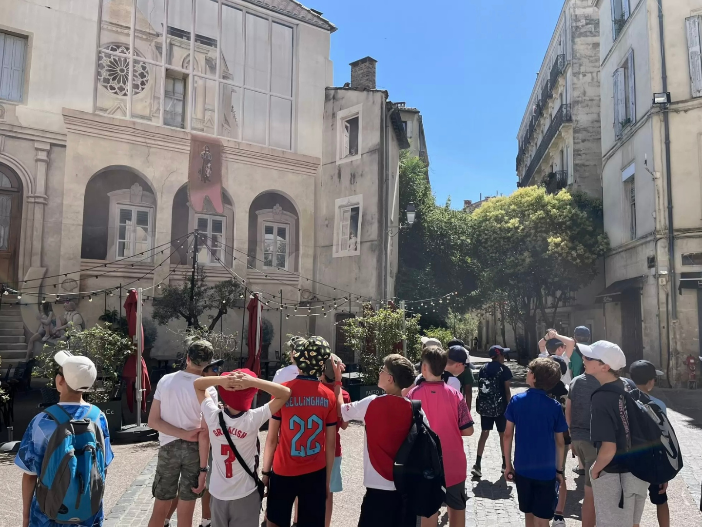 A group of students on a Blue Stamp Travel school trip to Montpellier enjoy a guided tour of the city