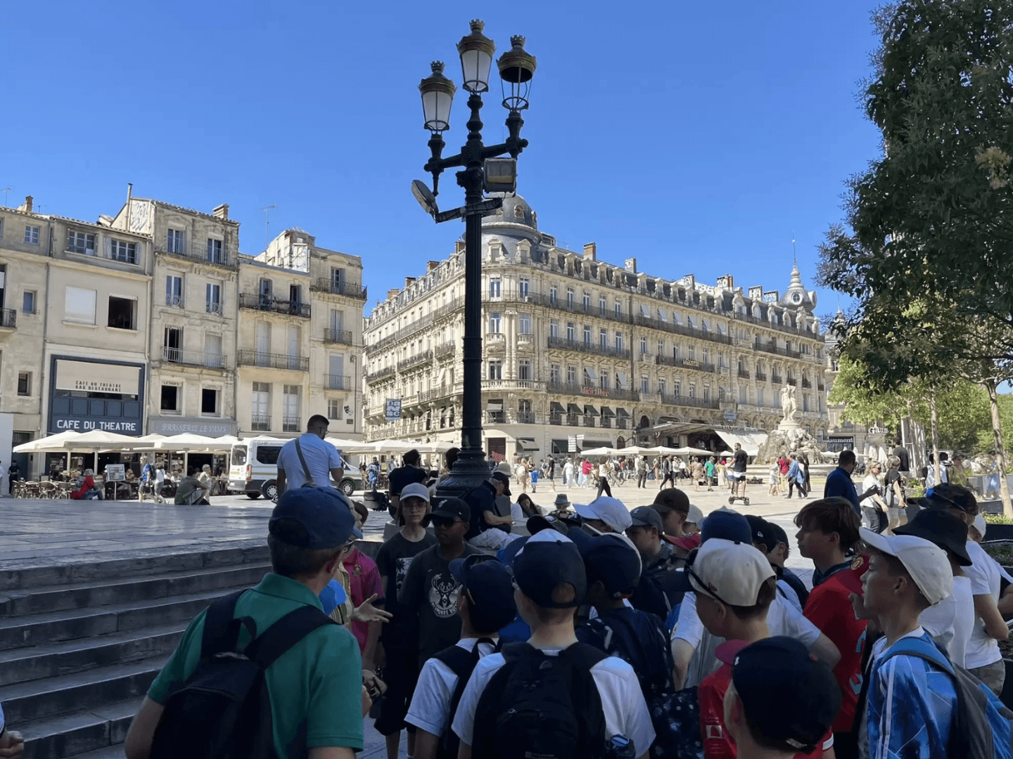 A A group of students on a Blue Stamp Travel school trip to Montpellier enjoying a guided tour of the city
