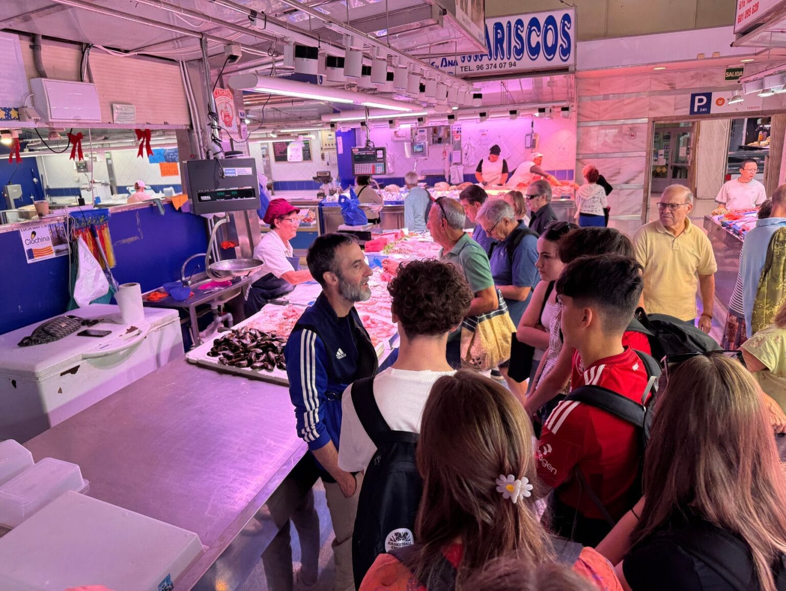 Learning about paella ingredients at Mercado de Ruzafa in Valencia.