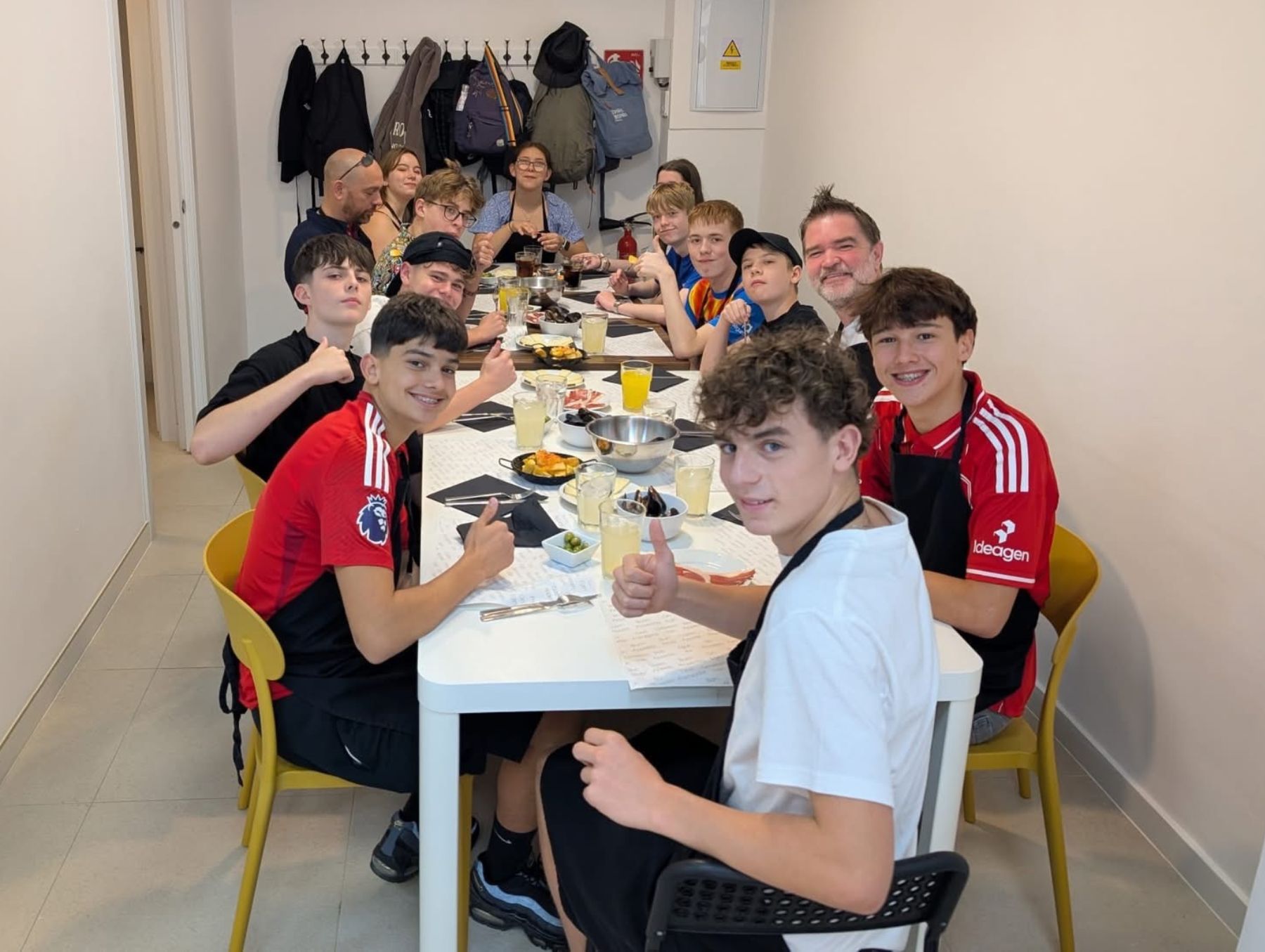 Students from CFSA eating their paella from their paella making workshop.