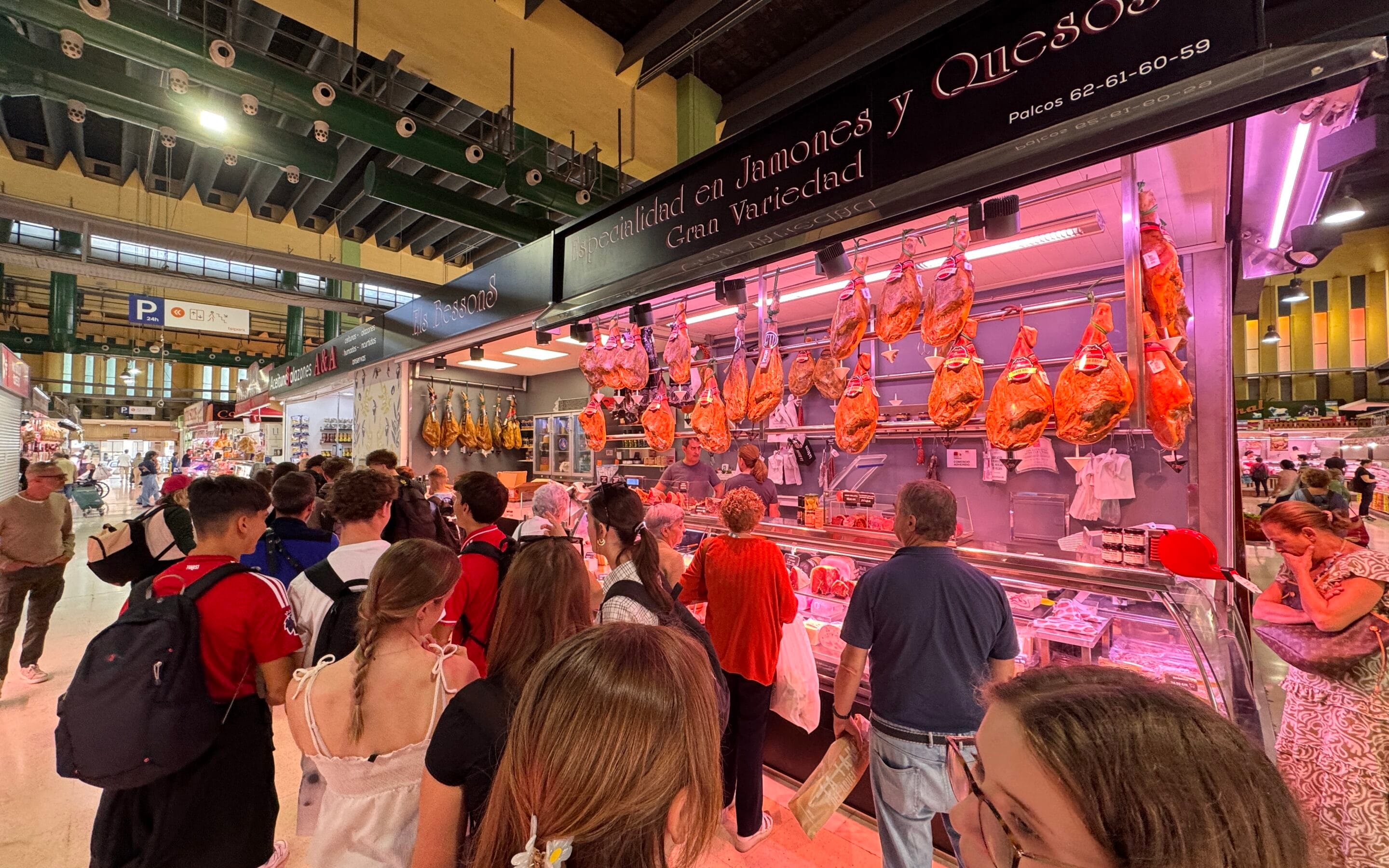 Learning about paella ingredients at Mercado de Ruzafa in Valencia.