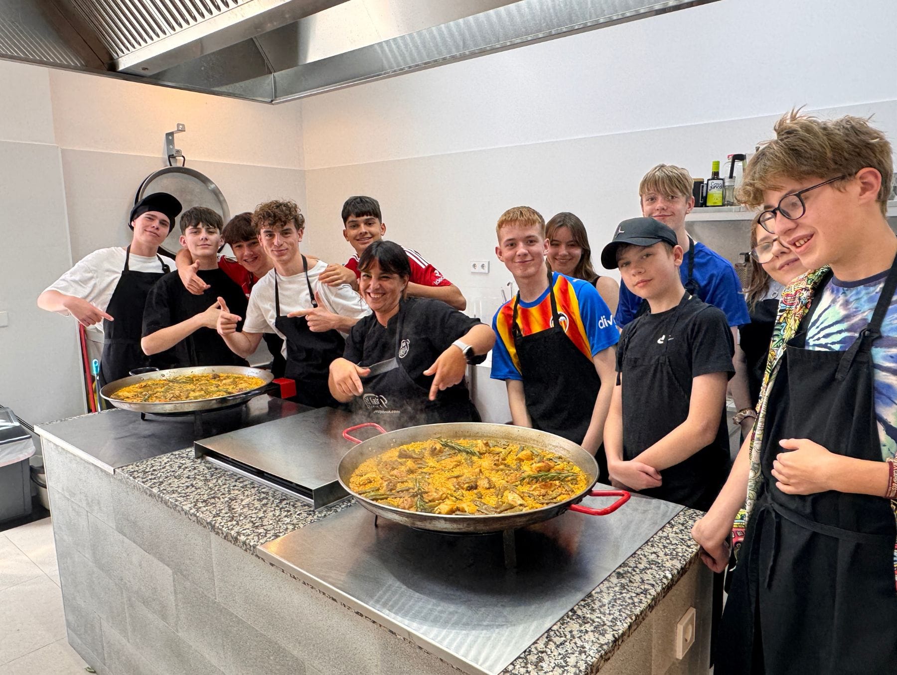 Students from CFSA with their finished paella from their paella making workshop.