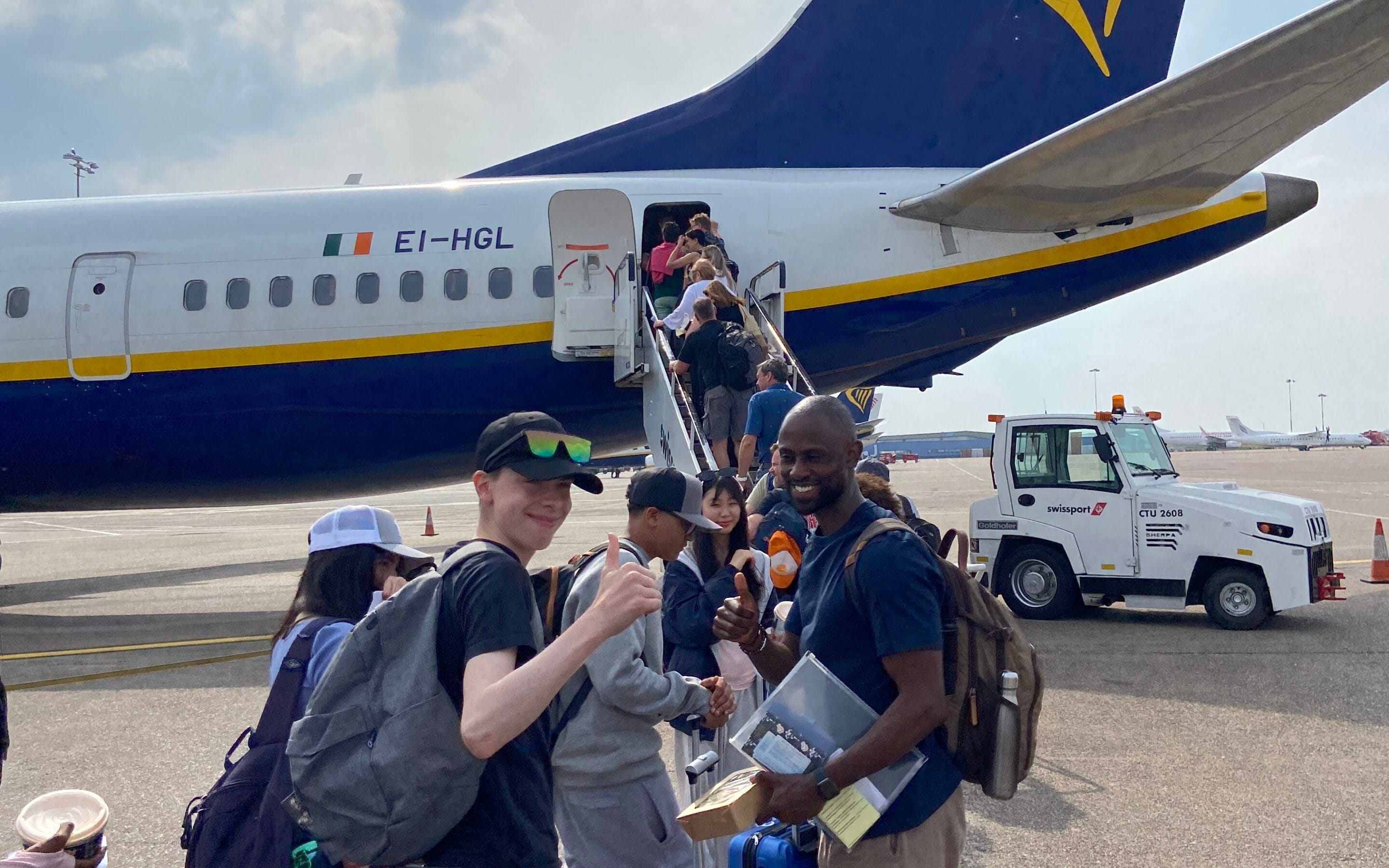 Students and teachers boarding a plane to Malaga on a trip organised by tour operator, Blue Stamp Travel.