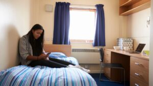 Stock image of a student in student residences.