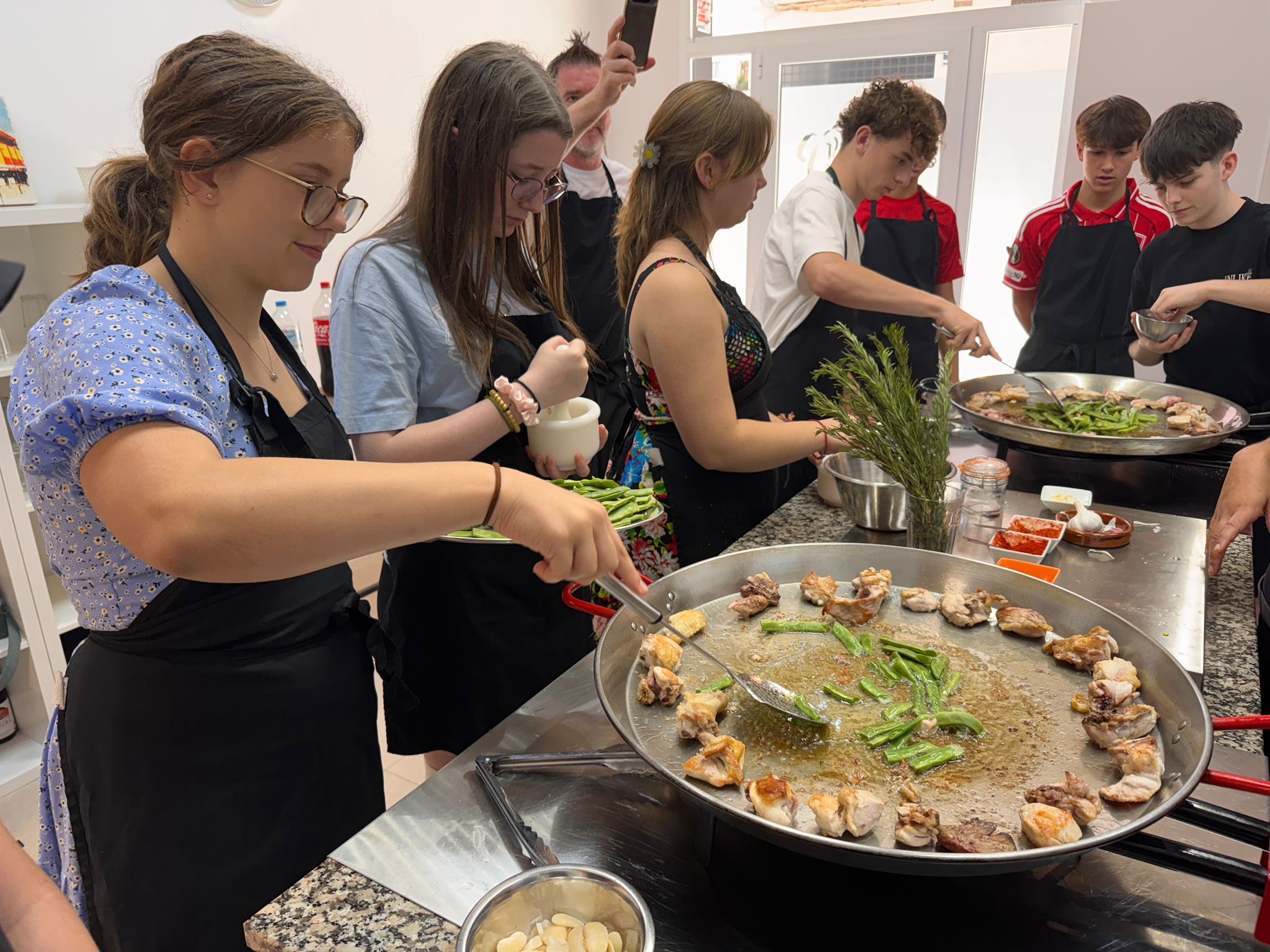 Photo of a typical Spanish cooking lesson – a paella making workshop.