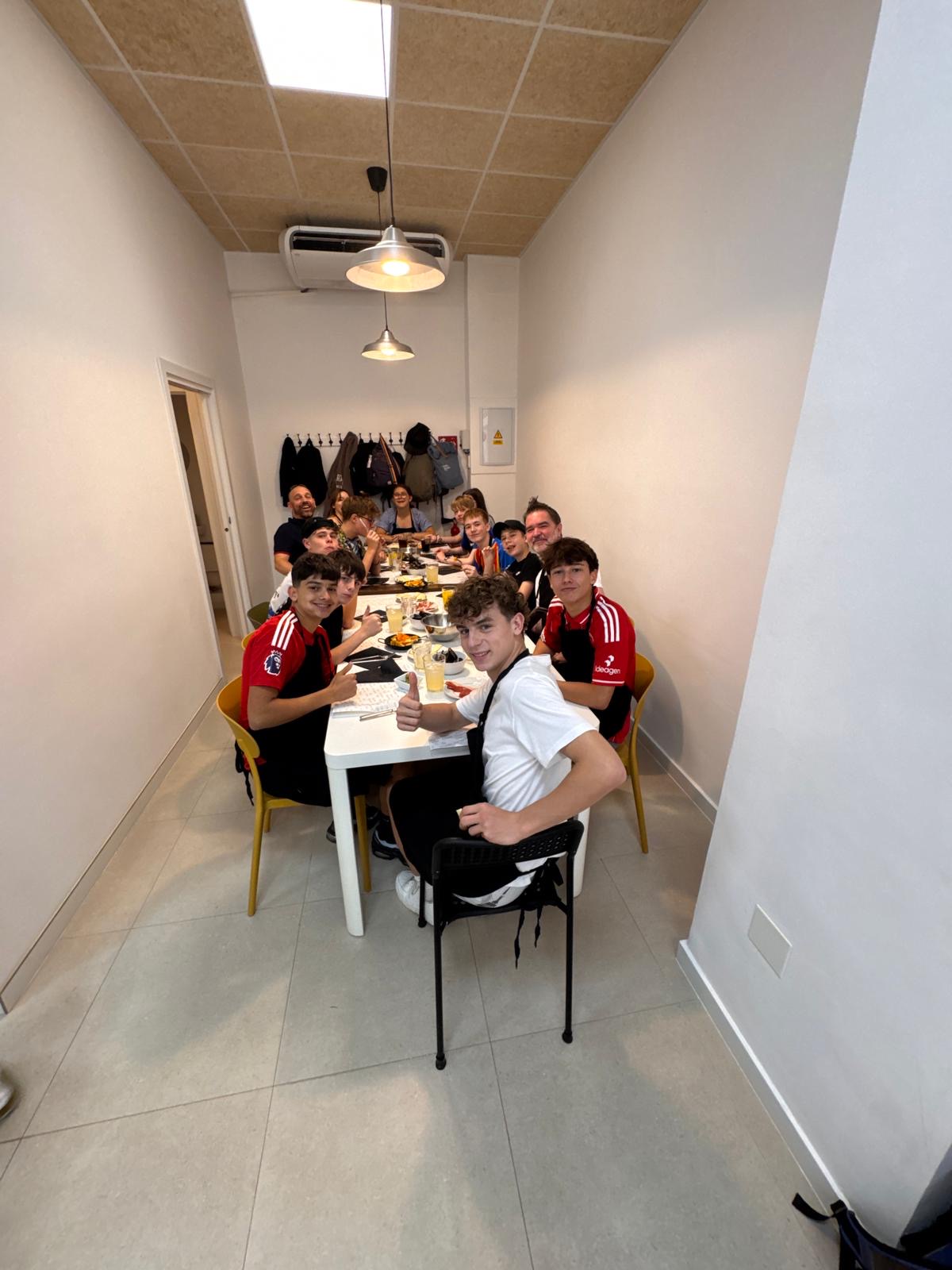 Photo of students sharing a meal after a Spanish cooking lesson.