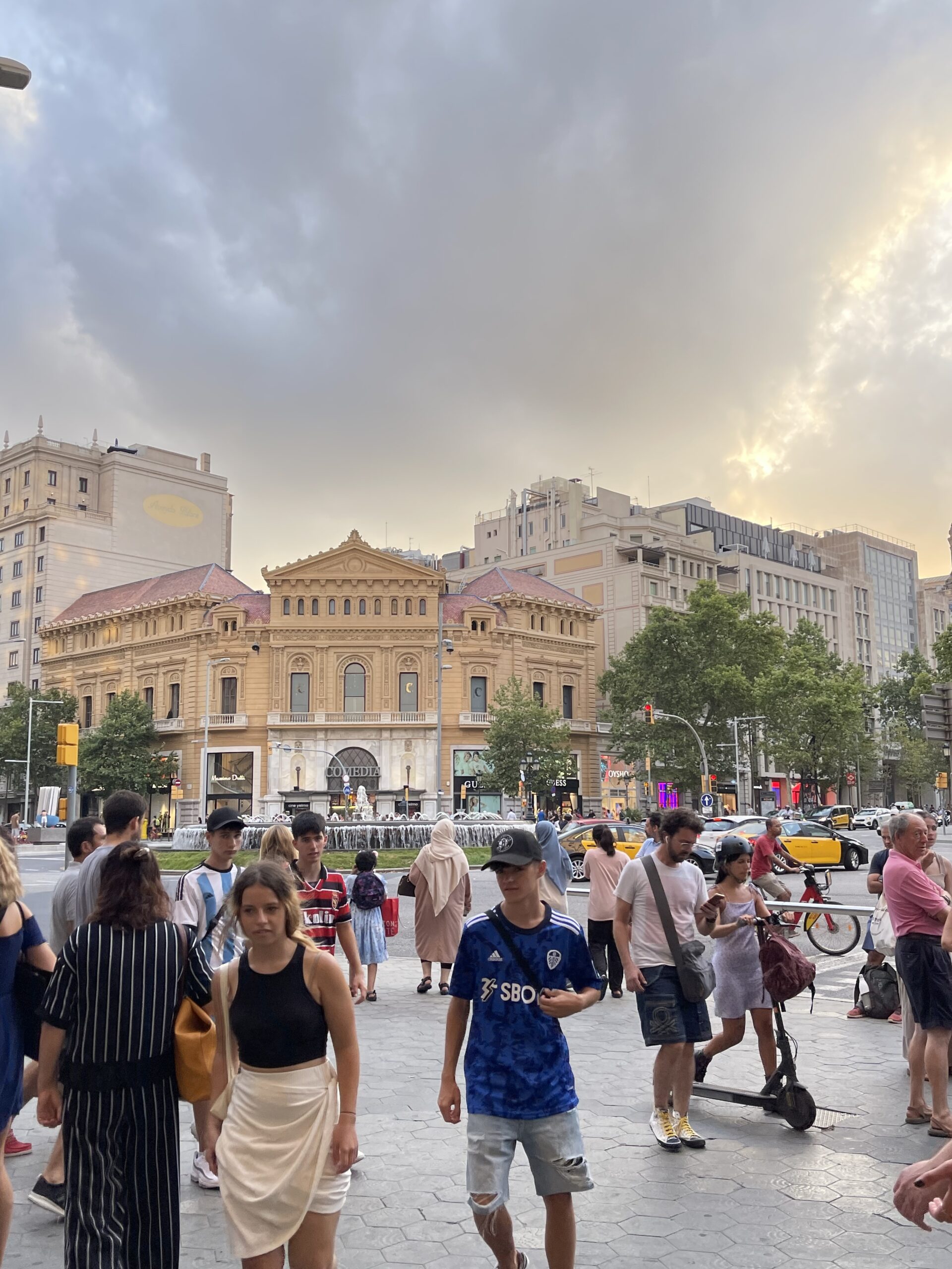 Photo of people in a street in Barcelona, Spain.