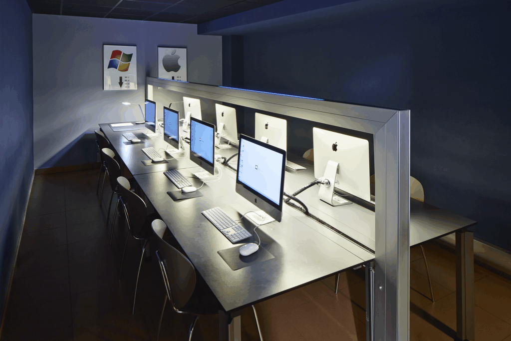 A computer room with 8 screens