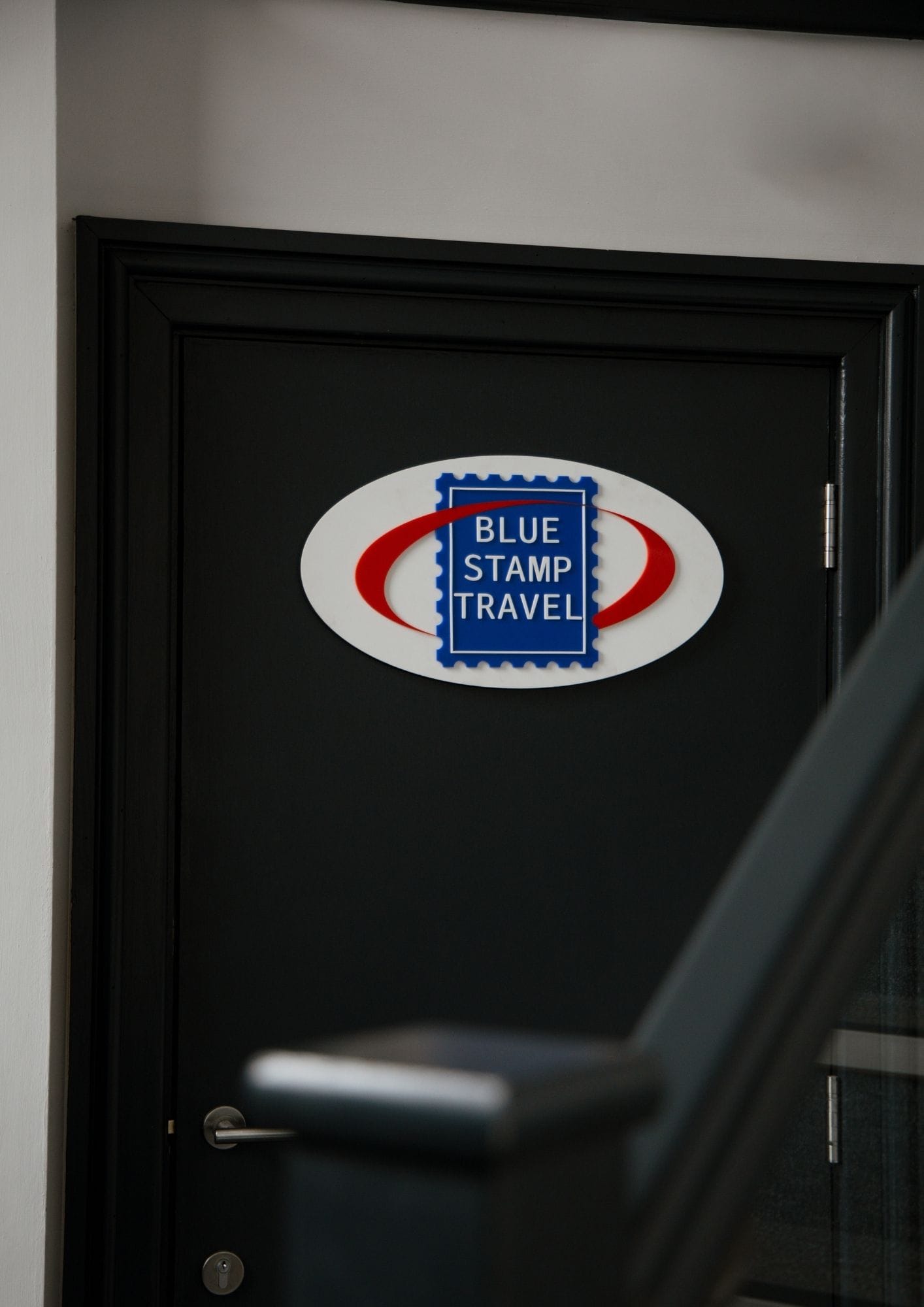 Blue Stamp Travel office sign.